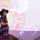 woman in front of birth chart