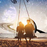 couple sitting on a swing