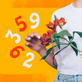 woman looking through window with numbers