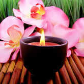 candle with pink orchids