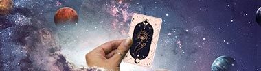 hand holding tarot card