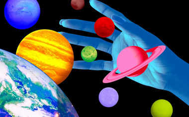 Technicolor planets float against a black background as a blue hand reaches out to grab them.