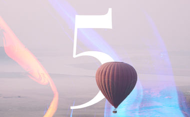 Life Path number 5 in numerology is represented by a hot air balloon in the sky.