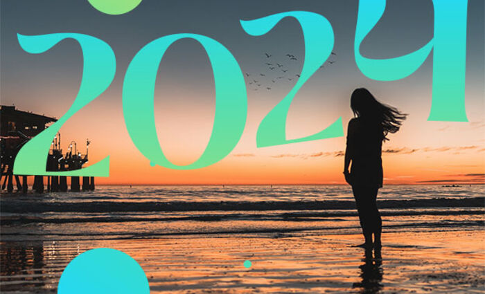 A person walks on the beach with the number 2024 overhead, representing the numerology of 2024.