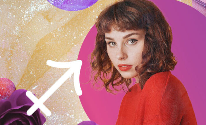 A woman in a red sweater stands against a cosmic background with the symbol for Sagittarius in 2024.