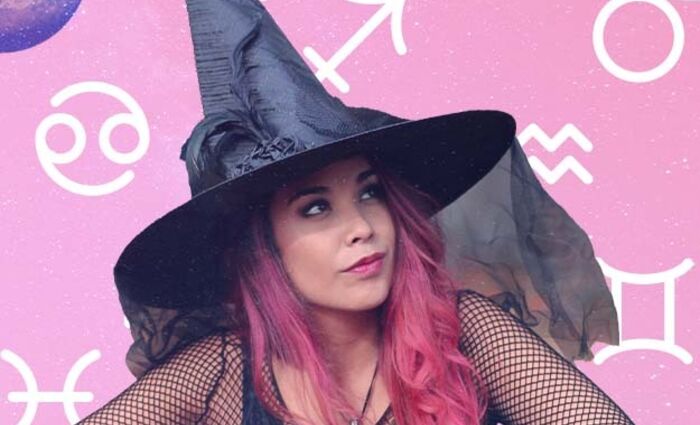 A woman in a witch's hat against a pink background represents Halloween for the zodiac signs.