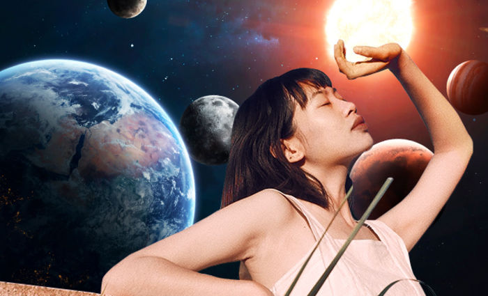Woman touching the planets