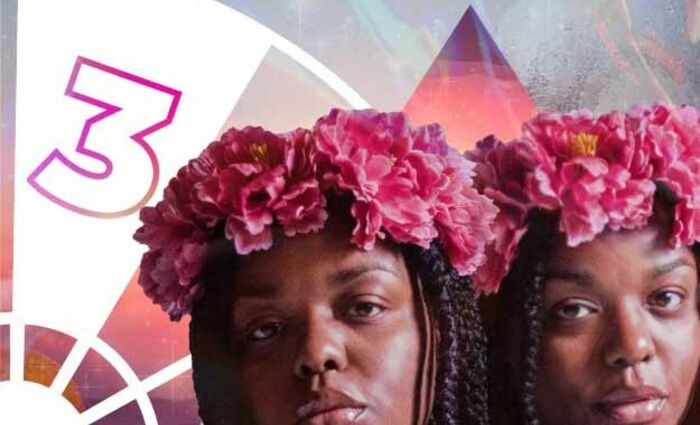 Two women wear matching pink flower crowns, representing the 3rd house in Astrology.