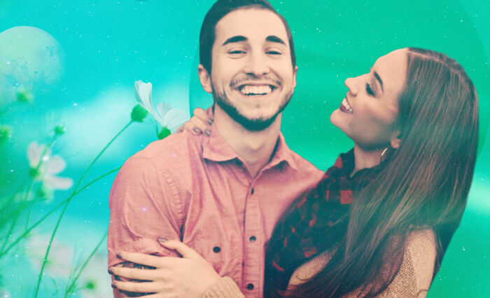 A couple smiles together against a green background for the 2023 Aquarius love horoscope.