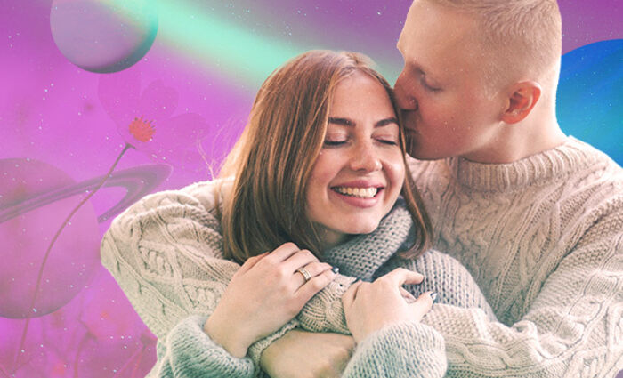A couple hugs in cozy sweaters against a purple background for the 2023 Aries love horoscope.