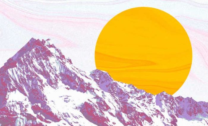 A bright yellow sun peeks out from behind a snowy mountain.