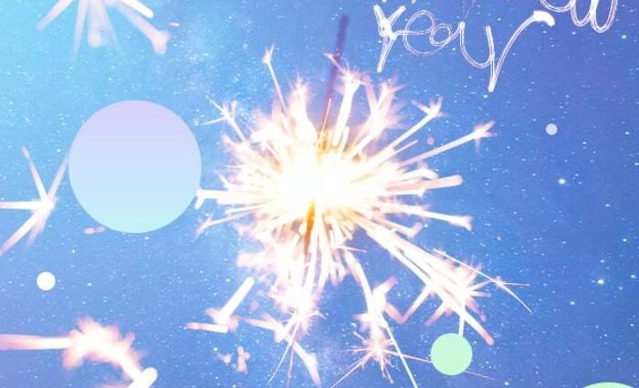 A sparkler shines against a blue background, representing New Year's celebrations and resolutions.