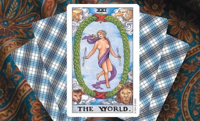 A classic World card rests on a floral tapestry.