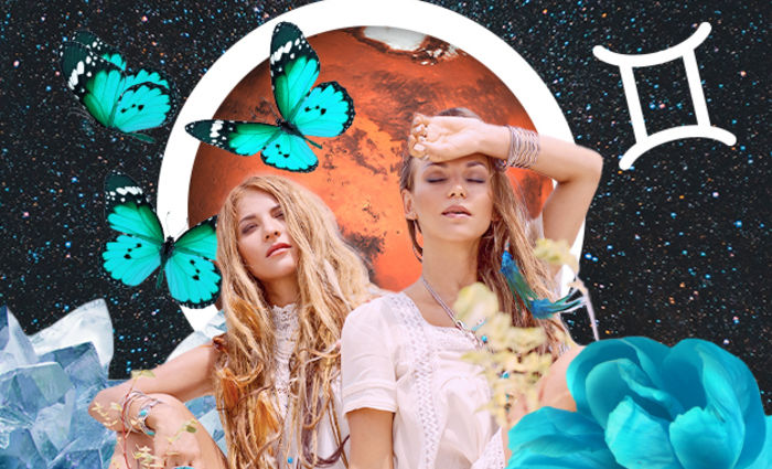 Two women in white dresses are surrounded by butterflies for the 2023 Gemini yearly horoscope.